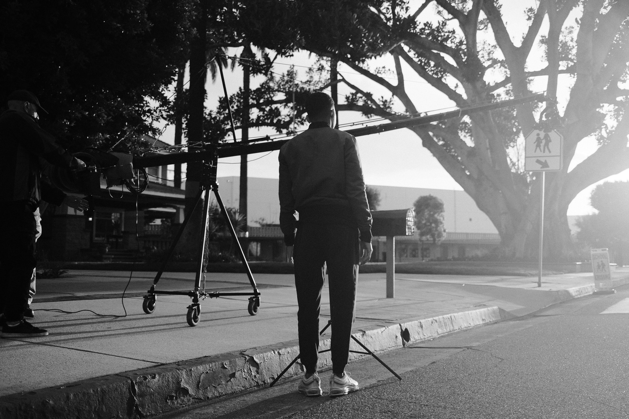 Camera crew operating a crane during an outdoor school production
